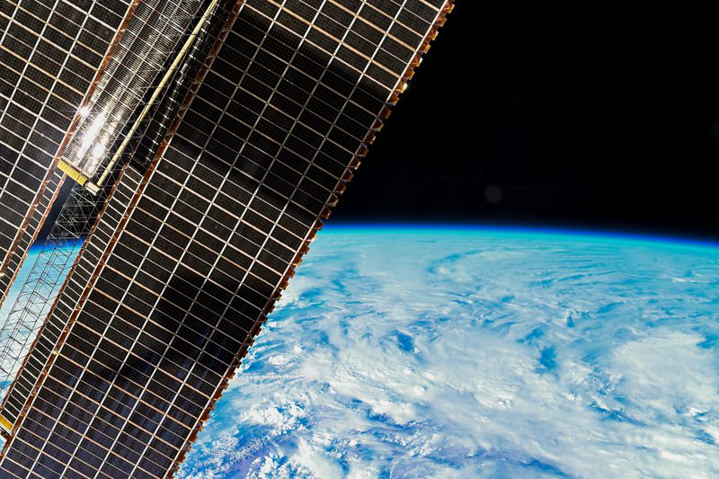 View of Earth and ISS Solar Arrays